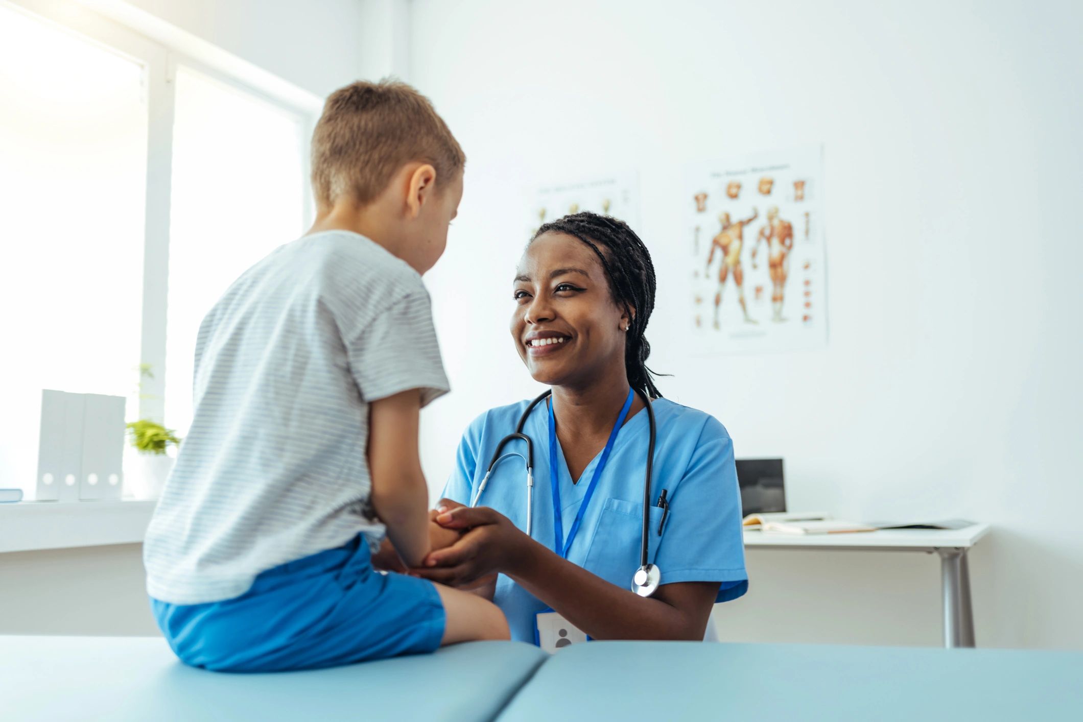 Doctor speaking with a parent and child during a consultation
